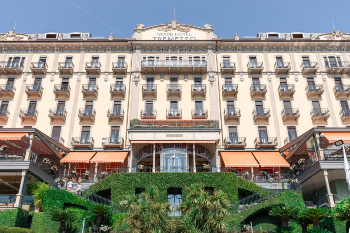 The Grand Hotel Tremezzo, a luxurious hotel on Lake Como, with its ornate façade and lush greenery